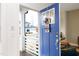 View through an open blue front door reveals a welcoming porch and a glimpse into the home's interior design at 106 Cottage Way # 33, Pittsboro, NC 27312