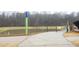 View of the community greenway path and pond at 106 Cottage Way # 33, Pittsboro, NC 27312