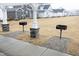 A community grilling area with several grills ready for neighborhood cookouts at 106 Cottage Way # 33, Pittsboro, NC 27312