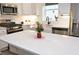 A spacious island with white quartz countertop enhances this open kitchen design at 106 Cottage Way # 33, Pittsboro, NC 27312