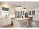 Bright kitchen featuring stainless steel appliances, quartz countertops, and a dining area at 106 Cottage Way # 33, Pittsboro, NC 27312
