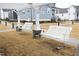 A community area featuring porch swings for relaxing in the neighborhood at 106 Cottage Way # 33, Pittsboro, NC 27312