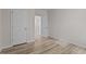 Empty bedroom with hardwood floors, two closets, and neutral paint, offering a blank canvas for personalization at 1107 Depot Dr, Durham, NC 27703
