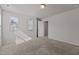 Bright bedroom with two windows providing natural light and plush carpeting at 1107 Depot Dr, Durham, NC 27703