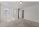 Bright bedroom with two windows providing natural light and plush carpeting at 1107 Depot Dr, Durham, NC 27703