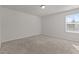 Cozy bedroom with a single window and neutral carpeting at 1107 Depot Dr, Durham, NC 27703