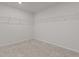 A spacious walk-in closet offering ample storage space with installed shelving at 1107 Depot Dr, Durham, NC 27703