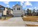 New construction home with a two-car garage, a concrete driveway and a well-maintained front lawn at 1107 Depot Dr, Durham, NC 27703
