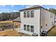 A two-story home with white siding, showcasing the backyard pond at 1107 Depot Dr, Durham, NC 27703