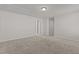 Spacious living room with plush carpet and neutral paint, offering a cozy space for relaxation at 1107 Depot Dr, Durham, NC 27703