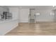 Bright living room featuring hardwood floors, stairs, and an open concept layout with easy access to the kitchen at 1107 Depot Dr, Durham, NC 27703