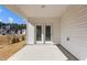 Covered patio area provides a relaxed outdoor setting with views of the surrounding neighborhood at 1107 Depot Dr, Durham, NC 27703