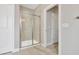 Bathroom featuring a glass-enclosed shower with beige tiling and white trim at 1109 Hemby Ridge Ln, Morrisville, NC 27560