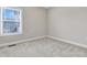 Bedroom featuring neutral carpet, light grey walls and natural light from a large window at 1109 Hemby Ridge Ln, Morrisville, NC 27560
