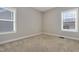 Bedroom featuring natural light with neutral carpet and light grey walls at 1109 Hemby Ridge Ln, Morrisville, NC 27560