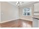 Cozy dining area with wood floors and a window providing natural light at 1109 Hemby Ridge Ln, Morrisville, NC 27560