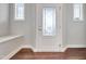 Bright entryway featuring decorative door glass, sidelight windows, and a convenient built-in bench at 1109 Hemby Ridge Ln, Morrisville, NC 27560