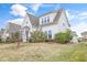 Well-maintained home featuring mature landscaping and a classic architectural design with ample lawn space at 1109 Hemby Ridge Ln, Morrisville, NC 27560