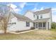 The house's exterior features an attached garage, and a screened-in porch, combining convenience with outdoor enjoyment at 1109 Hemby Ridge Ln, Morrisville, NC 27560