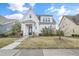 Charming two-story home with a manicured lawn, inviting entrance and classic architectural details at 1109 Hemby Ridge Ln, Morrisville, NC 27560