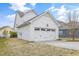 A clean white garage door complements the home's exterior and provides an attached parking and storage solution at 1109 Hemby Ridge Ln, Morrisville, NC 27560