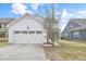 A clean white garage door complements the home's exterior and provides an attached parking and storage solution at 1109 Hemby Ridge Ln, Morrisville, NC 27560