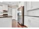Well-equipped kitchen with stainless steel appliances, white cabinetry, and granite countertops at 1109 Hemby Ridge Ln, Morrisville, NC 27560