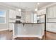 Bright kitchen featuring an island with seating, stainless steel appliances, and pendant lighting at 1109 Hemby Ridge Ln, Morrisville, NC 27560