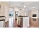 Open concept kitchen featuring an island, stainless steel appliances, and hardwood floors at 1109 Hemby Ridge Ln, Morrisville, NC 27560