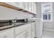 A laundry room features modern appliances, ample counter space, and practical storage, combining function with style at 1109 Hemby Ridge Ln, Morrisville, NC 27560