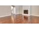 Cozy living room features a fireplace and entryway, complemented by hardwood flooring at 1109 Hemby Ridge Ln, Morrisville, NC 27560