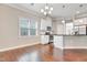 Open concept living space features wood floors, modern kitchen, and dining area at 1109 Hemby Ridge Ln, Morrisville, NC 27560
