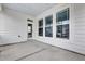 A spacious patio provides a neutral outdoor space with a door leading to the interior, ideal for relaxation at 1109 Hemby Ridge Ln, Morrisville, NC 27560