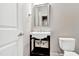 Chic powder room features a pedestal sink, modern fixtures, and a sleek design at 1109 Hemby Ridge Ln, Morrisville, NC 27560