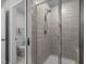 Modern bathroom boasting a glass shower with tiled walls and a view of the toilet at 112 Velten Ridge Dr, Durham, NC 27713