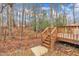 Beautiful backyard featuring a wooden deck with stairs, perfect for outdoor enjoyment at 118 Gracie Ln, Clayton, NC 27520