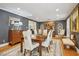 Elegant dining room featuring wood floors, a sophisticated color scheme, and refined decor at 14115 Allison Dr, Raleigh, NC 27615