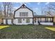 Stylish two-story home with white brick, contrasting black trim, and a well-maintained front lawn at 14115 Allison Dr, Raleigh, NC 27615