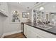 Kitchen features a counter with bar sink and seating, offering an integrated living space at 14115 Allison Dr, Raleigh, NC 27615