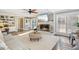 Spacious living room features built-in bookshelves, fireplace, ceiling fan and large windows at 14115 Allison Dr, Raleigh, NC 27615