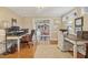 Cozy home office space featuring hardwood floors, ample desk space, and a comfortable seating arrangement at 14115 Allison Dr, Raleigh, NC 27615