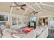 Open sunroom featuring vaulted ceilings, a comfortable sectional, and a view of the outdoors at 14115 Allison Dr, Raleigh, NC 27615