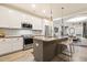 Modern kitchen featuring white cabinets, stainless steel appliances, and granite countertops at 1501 Millrock Trl, Wendell, NC 27591