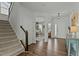 Welcoming foyer offering hardwood flooring, staircase, and view into the adjacent office space at 1513 Reynolds Mill Rd, Wake Forest, NC 27587