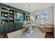 Cozy home office featuring a spacious desk, custom cabinetry, and a bright, airy atmosphere at 1513 Reynolds Mill Rd, Wake Forest, NC 27587