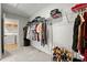 Spacious walk-in closet offering ample storage with rods, shelves, and shoe racks at 1513 Reynolds Mill Rd, Wake Forest, NC 27587