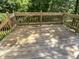 Well-maintained wooden back deck with lush green view at 1599 Rogers Pointe Ln, Creedmoor, NC 27522