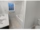 Bright bathroom with double sinks, white tub, and stylish finishes at 1599 Rogers Pointe Ln, Creedmoor, NC 27522