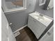 Clean powder room featuring wood-look floor and modern sink at 1599 Rogers Pointe Ln, Creedmoor, NC 27522