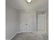 Bedroom featuring a closet with double doors and a view into another room at 1599 Rogers Pointe Ln, Creedmoor, NC 27522